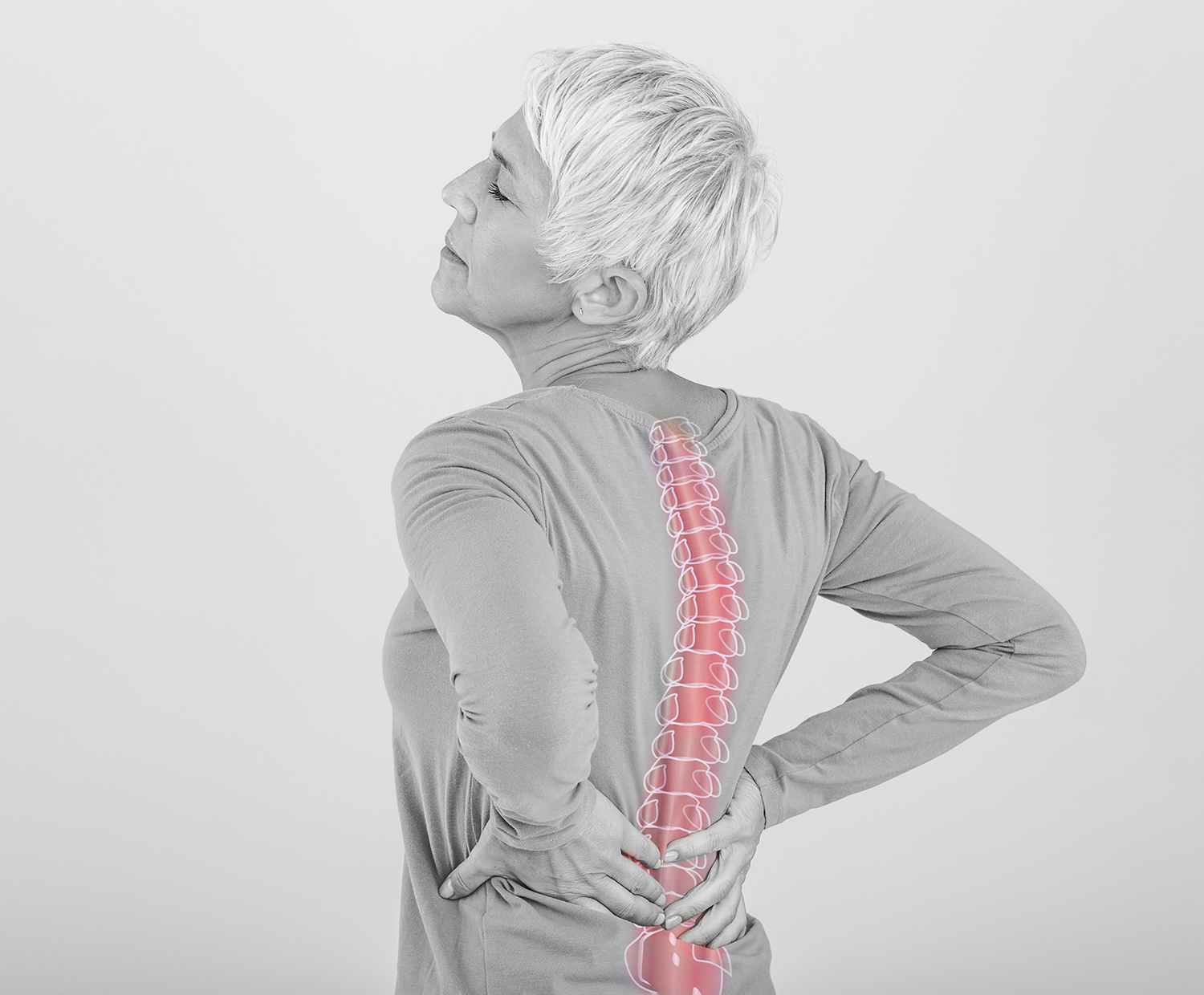 Senior woman experiencing back pain