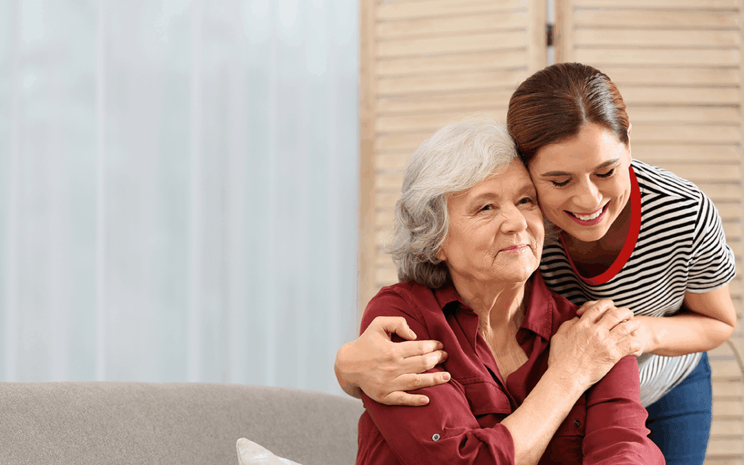 Dementia patient hugging caregiver